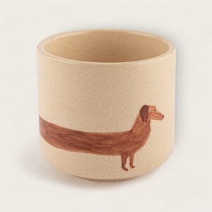 Handcrafted mug with an illustration of a brown dachshund, perfect for a whimsical kitchen collection