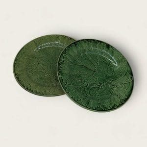 Victorian-era Majolica Plates in an elegant green, showcasing detailed leaf designs and antique charm.
