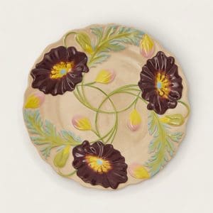 Hand-painted ceramic plate with Art Nouveau maroon poppies and greenery accents.