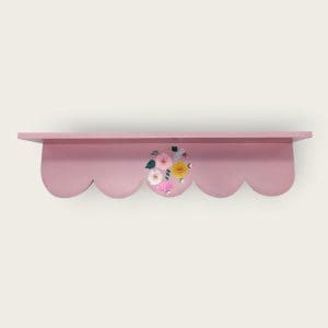 Soft pink scalloped wooden shelf with a charming array of hand-painted flowers.