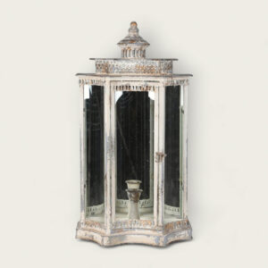 a distressed metal wall lantern with mirror and glass panels and a weathered finish.