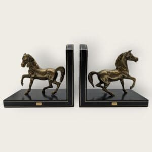 Rare vintage brass horse bookends from Liberty of London on a leather base, with exquisite detailing.
